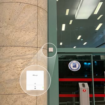 Milesight AM308L indoor air quality sensor mounted at an airport terminal